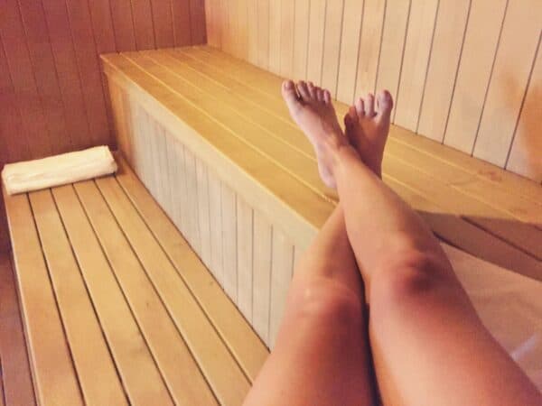 Female legs point of view relaxing in the sauna