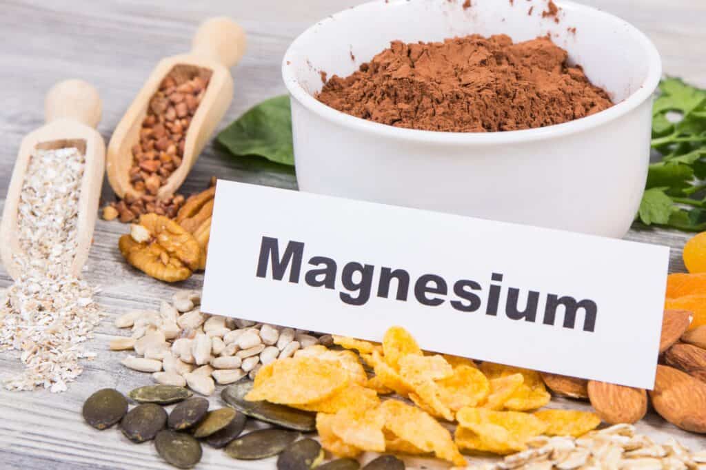Inscription magnesium with healthy food containing natural magnesium